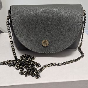 Faux leather mini cross body bag with metal strap.